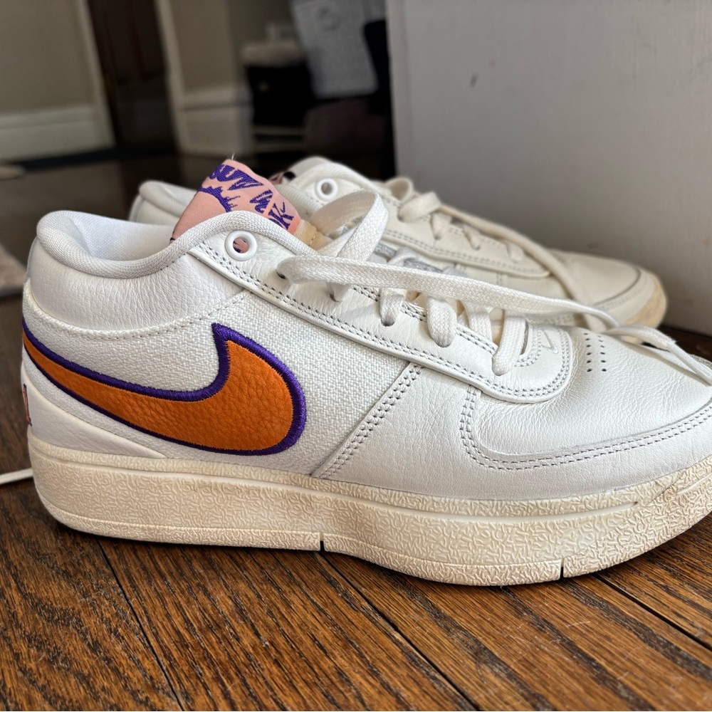 Nike Kids White Sneakers with Orange and Purple Swoosh